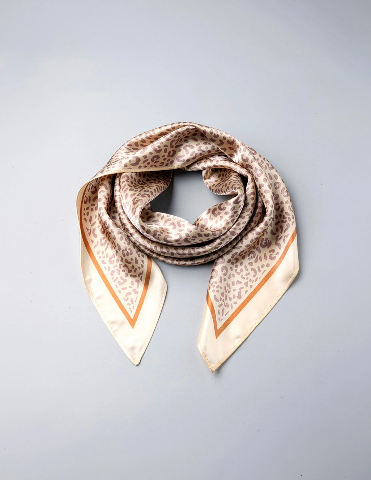 Leopard print triangle scarf in cream and tan