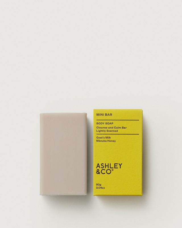 Ashley & Co Mini Bar 90g soap with yellow packaging and the unwrapped bar